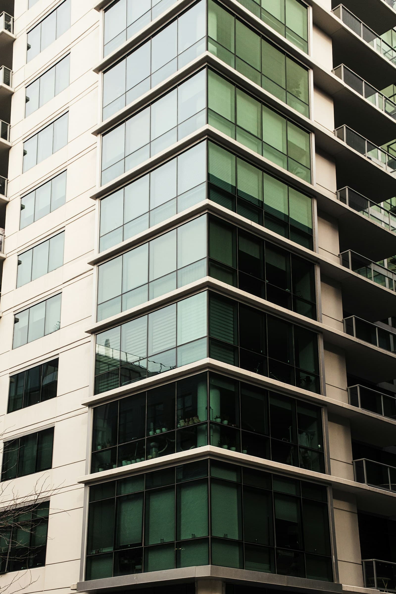 Modern mixed-use tower with glass balconies